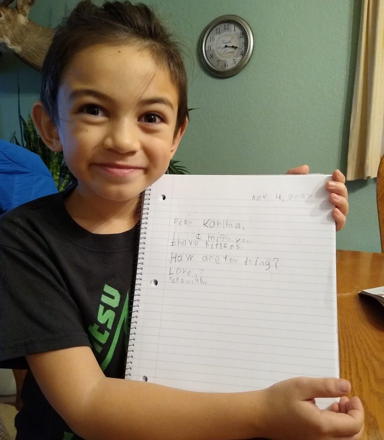 student showing letter to tutor