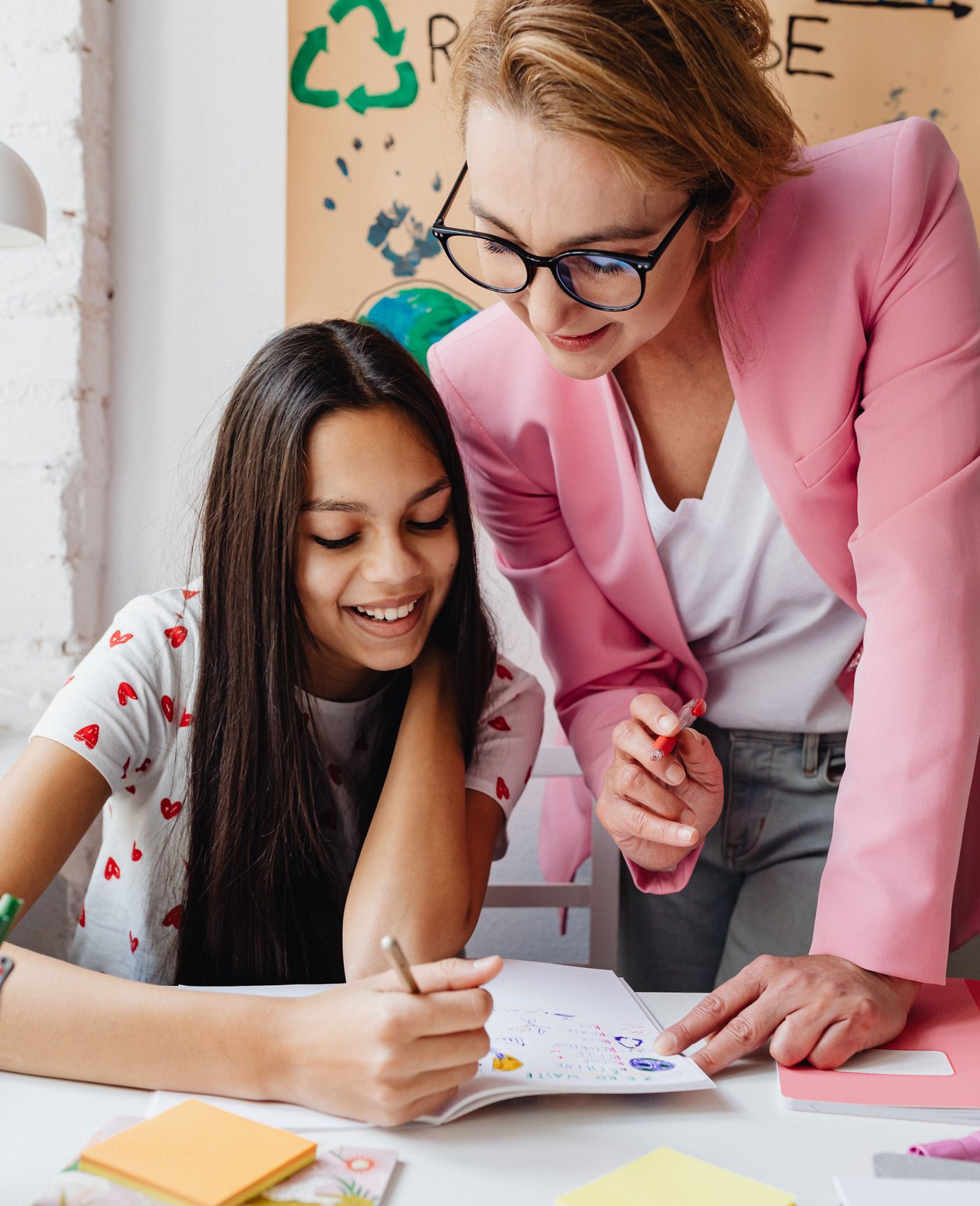tutor helping older student with math